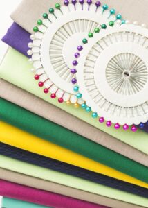 top-view-variety-fabrics-with-needles